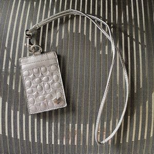Silver coach badge holder